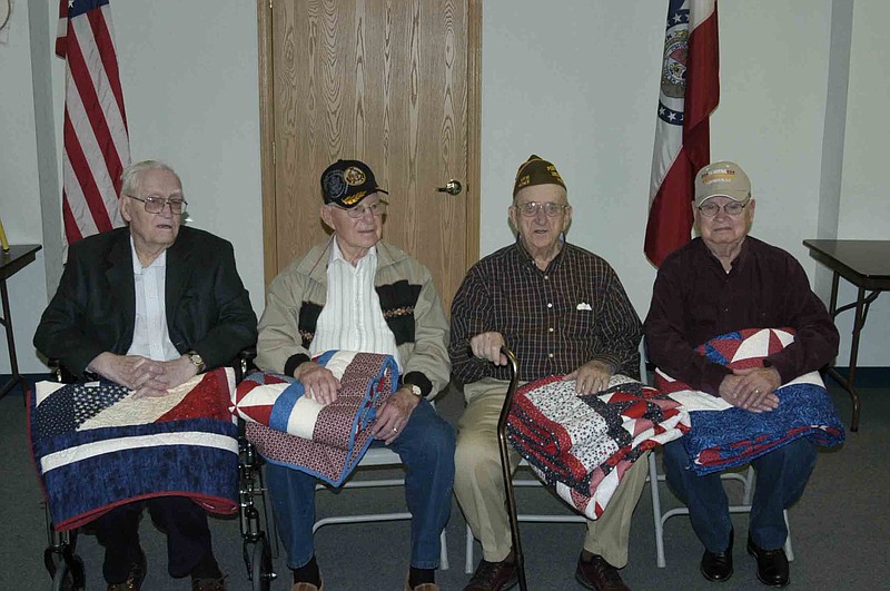 Democrat photo / David A. Wilson
From left, Ward Geier (Army), Floyd Rice (Army), John Dorn (Navy) and Don Hofstetter (Army) were presented with Quilts of Valor in recognition of their service during World War II. The presentations were made Saturday, Nov. 9.