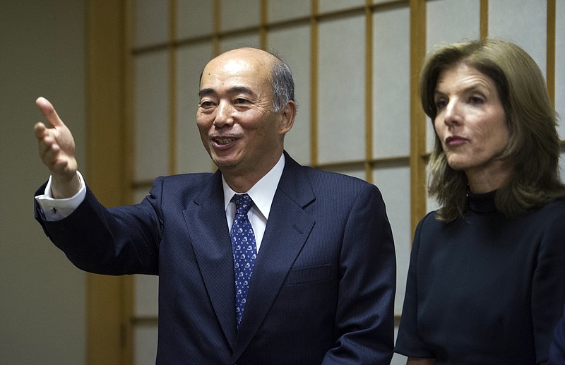 Japanese Ambassador to the United States Kenichiro Sasae, left, gestures Tuesday while he and U.S. Ambassador to Japan Caroline Kennedy participate in Japanese Ambassador's residence in Washington. Kennedy, the new U.S. ambassador to Japan and daughter of slain President John F. Kennedy, leaves for Japan on Thursday to begin her work to strengthen the critical bond between the U.S. and the Asian nation.