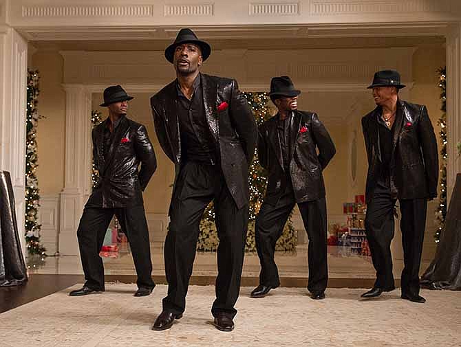 This image released by Universal Pictures shows, from left, Taye Diggs, Morris Chestnut, Harold Perrineau and Terrence Howard in a scene from "The Best Man Holiday." 