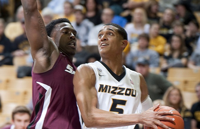 Jordan Clarkson of Missouri drives to the basket as Jalen Pendleton of Southern Illinois defends during the first half of Tuesday night's game at Mizzou Arena.