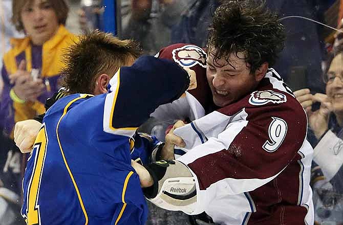 St. Louis Blues left wing Vladimir Sobotka, left, fights with Colorado Avalanche center Matt Duchene during the second period of an NHL hockey game, Thursday, Nov. 14, 2013, in St. Louis. (AP Photo/St. Louis Post-Dispatch, Chris Lee) 