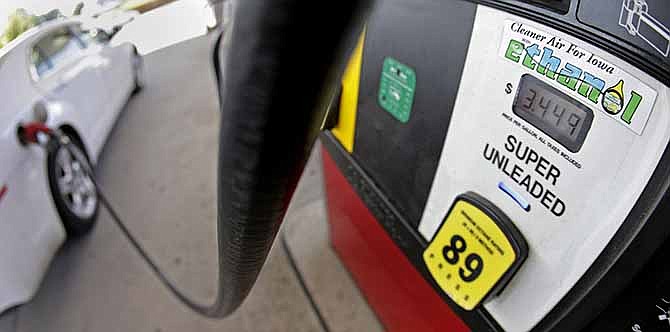 This July 26, 2013 file photo shows a motorist filling up with gasoline containing ethanol in Des Moines. The Obama administration on Friday proposed to reduce the amount of ethanol in the nation's fuel supply for the first time, acknowledging that the biofuel law championed by both parties in 2007 is not working as well as expected.