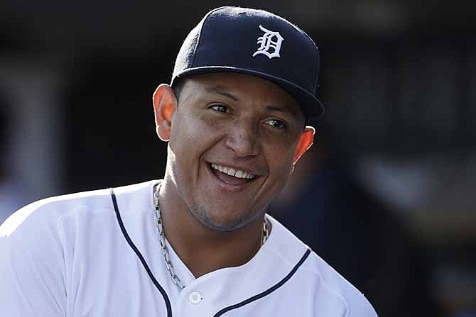 In this July 13, 2013, photo, Detroit Tigers third baseman Miguel Cabrera smiles in the dugout before a baseball game against the Texas Rangers in Detroit. Cabrera has won the American League Most Valuable Player award for the second straight year. 