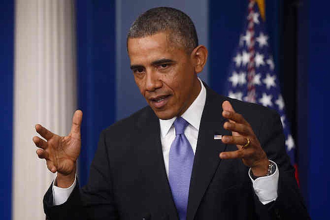 President Barack Obama gestures as he speaks about his signature health care law, Thursday, Nov. 14, 2013, in the Brady Press Briefing Room of the White House in Washington. Again and again, Obama shouldered the blame for his botched health care rollout in unusually blunt terms - a step many of his critics contend was long overdue. 