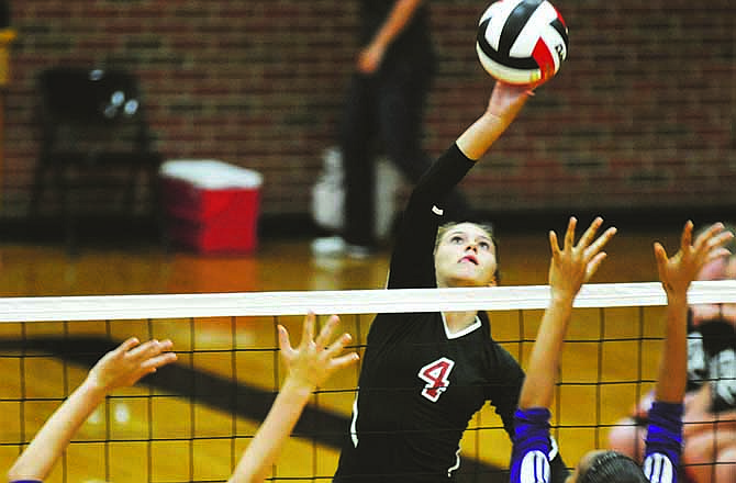 Jefferson City's Abbi McKnelly, shown tipping a ball against Hickman during a match this season, has earned all-state honors for the second straight season.