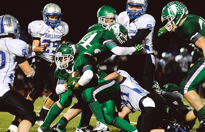 Blair Oaks running back Caleb Bischoff keeps his legs pumping while churning for extra yards against South Callaway on Monday at the Falcon Athletic Complex.
