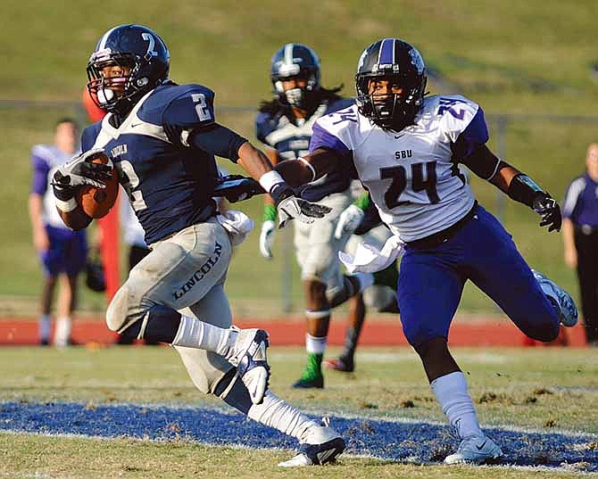 Lincoln running back Morris Henderson slips past Southwest Baptist defensive back Karre' Wallace and breaks free for a first down Saturday at Dwight T. Reed Stadium in Jefferson City.