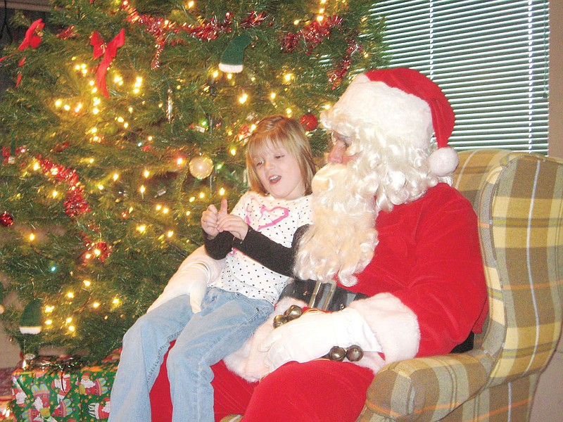 Breauna Hollis, then aged 6, has a talk in 2010 with Santa about bringing her a pony and a playhouse for Christmas. The Callaway County United Way's Breakfast with Santa will return this year after a hiatus Dec. 7 at the Callaway Senior Center.
