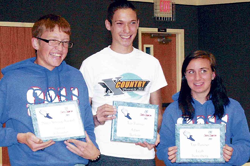 Democrat photo / April Arnett
Awardees at the CHS Cross Country Banquet Thursday night, from left, are Simon Schroeter, who received the Pinto Strong Award; Adam Burkett, who received the Boys Top Runner Award; and Leah Korenberg, Girls Top Runner Award. 