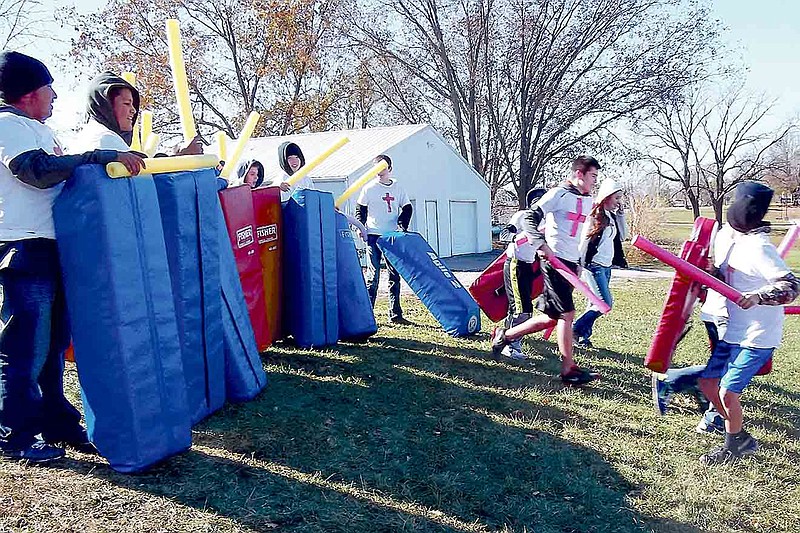 Photos submitted
At left, the ferocity of warfare between the two armies at the Battle of Hastings is shown up close and personal in the re-enactment at the California Middle School football practice field Nov. 12. At right is Williams' first retreat from the conflict.  