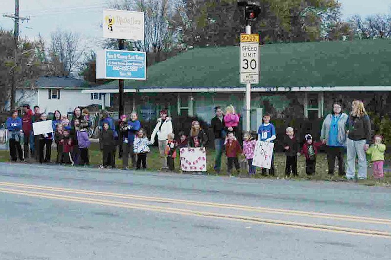 Democrat photo / David A. Wilson
People of all ages line the highway in a final vigil for Chad Stover on the day he died.