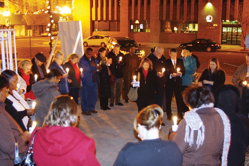 A group of people observe a candlelight vigil at last year's Celia Commemoration. This year's event will feature a format change to a banquet, and will also honor a local Callaway County woman working toward social justice for the inaugural Jane Bierdeman-Fike Humanitarian Award.