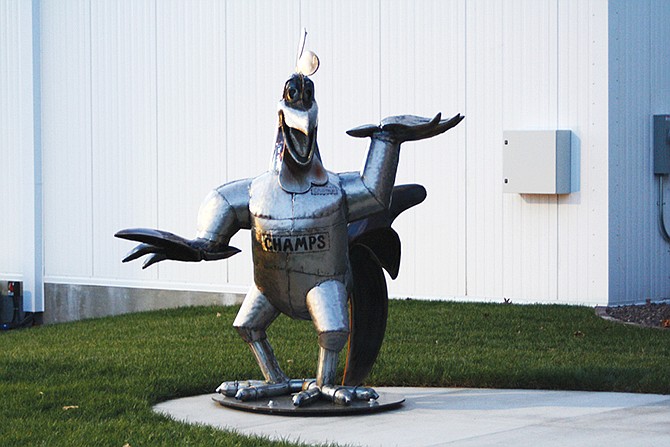 A metalwork Champ greets visitors as they enter the new 65,000-square-foot distribution center in Holts Summit. Pro Food Services, the company that produces Champs Chicken, unveiled the distribution center and national corporate headquarters Tuesday in a ribbon cutting and open house reception.