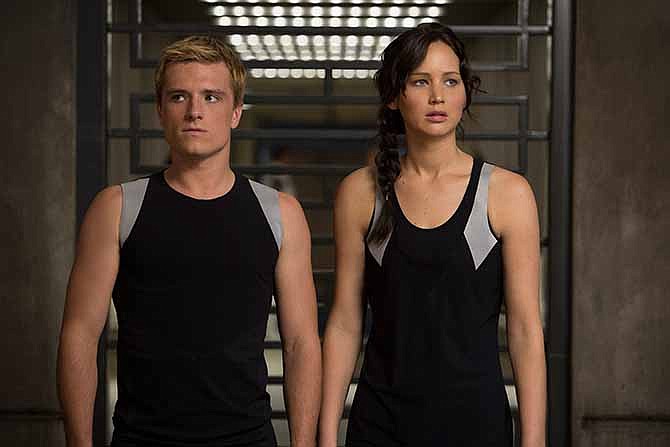 This image released by Lionsgate shows Josh Hutcherson as Peeta Mellark, left, and Jennifer Lawrence as Katniss Everdeen in a scene from "The Hunger Games: Catching Fire." 