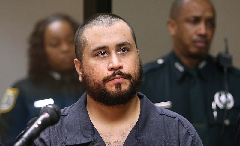 George Zimmerman, acquitted in the high-profile killing of unarmed black teenager Trayvon Martin, listens in court Tuesday in Sanford, Fla., during his hearing on charges including aggravated assault stemming from a fight with his girlfriend.