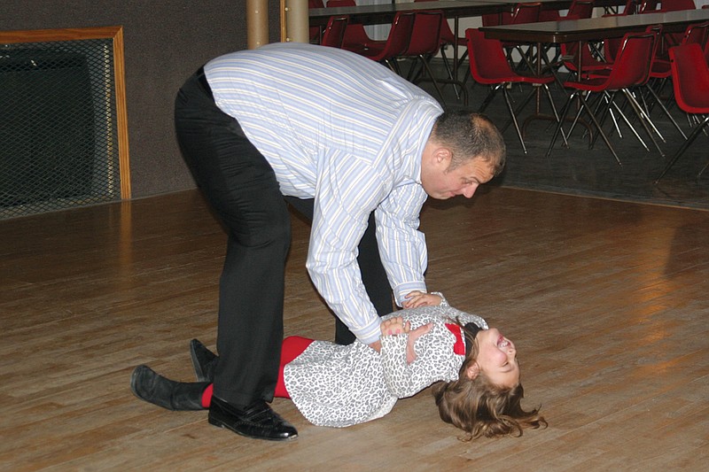 Kevin Coffelt scoots his dance partner along the floor during Boyd & Boyd Inc. and Friends' second annual Daddy Daughter Dance Night last year. This year's event will be held 4-6:30 p.m. Nov. 23 at KC Country.