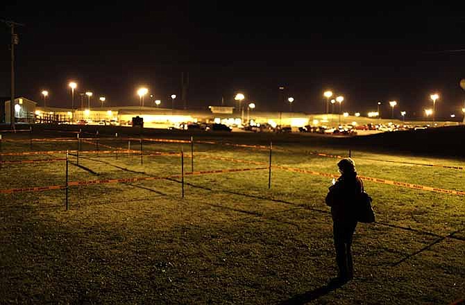 Death penalty opponent Margaret Phillips stands alone in an area set aside for protesters outside the Potosi Correctional Center on Tuesday night before the scheduled execution of Missouri death row inmate Joseph Paul Franklin..