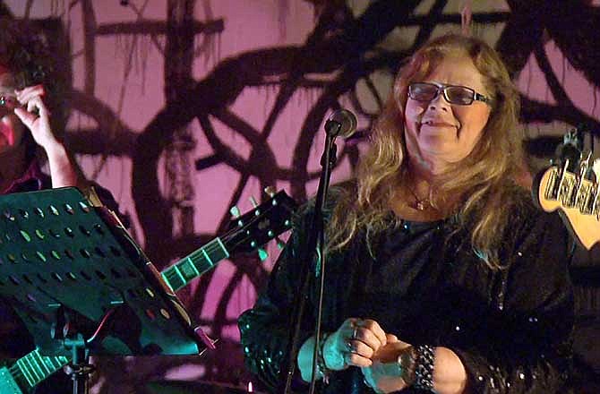 In this image taken from video Nov. 6, 2013, Dot Semprini as seen with the Dot Wiggin Band at the 285 Kent club in Brooklyn, N.Y. Semprini was one of the original members of The Shaggs, an obscure female band from Fremont, N.H. Now at 65 she has returned to the stage to sing to her loyal fans. 