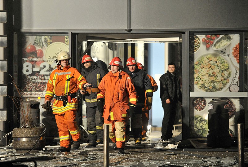Rescuers work at the Maxima grocery store after its roof collapsed in Riga, Latvia.