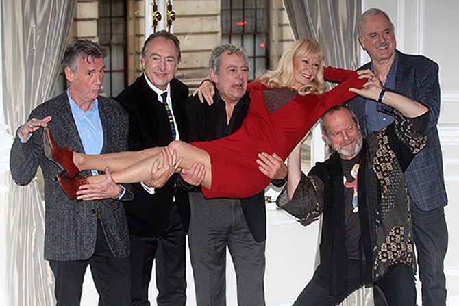 The surviving members of the Monty Python comedy group, from left, Michael Palin, Eric Idle, Terry Jones, Terry Gilliam, and John Cleese pick up their co-star Carol Cleveland while posing Thursday for photographers during a photocall to promote a reunion stage show they are going to perform together. The group had its first big success with the Monty Python's Flying Circus TV show, which ran from 1969 until 1974, winning fans around the world with its bizarre sketches. 