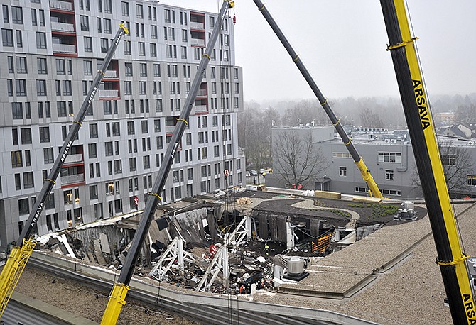 At least 51 people died, including three firefighters, after an enormous section of roof collapsed at a Latvian supermarket in the country's capital, emergency medical officials said Friday. The reason for the collapse during shopping rush-hour Thursday was still not known, but rescue and police officials said that possible theories include building design flaws and poor construction work.