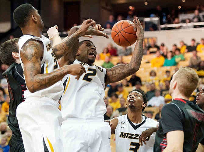 Missouri's Earnest Ross, left, Tony Criswell (2) and Johnathan Williams III (3) battle each other for a rebound while Gardner Webb's Logan Stumpf, right, stands by during the first half of an NCAA college basketball game Saturday, Nov. 23, 2013, in Columbia, Mo. 