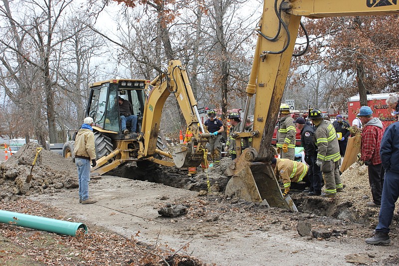 Fulton first responders worked to remove John Bestgen of California from a ditch that partially collapsed on him Monday while he worked to excavate a sewer main off of Country Club Drive. Bestgen was taken to University Hospital and treated for non-life-threatening injuries.