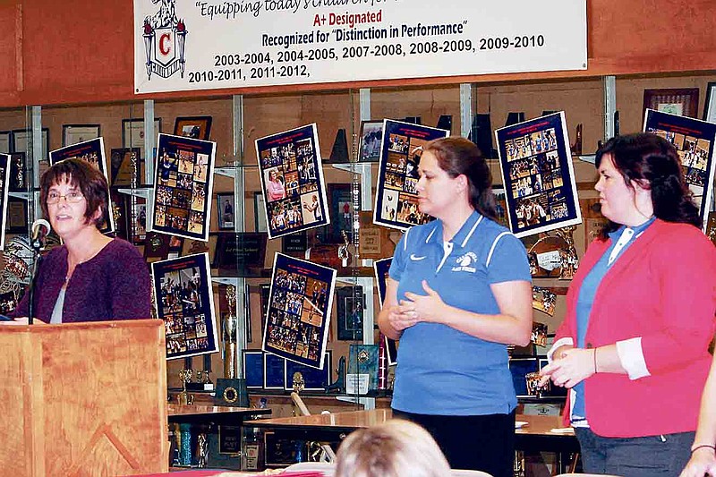 Democrat photo / April Arnett
California High School Head Volleyball Coach Julie Bailey, at left, speaks at the CHS Volleyball Banquet Nov. 19. At right, from left, are JV White Coach Sarah Hays and JV Blue Coach Maggie Long.