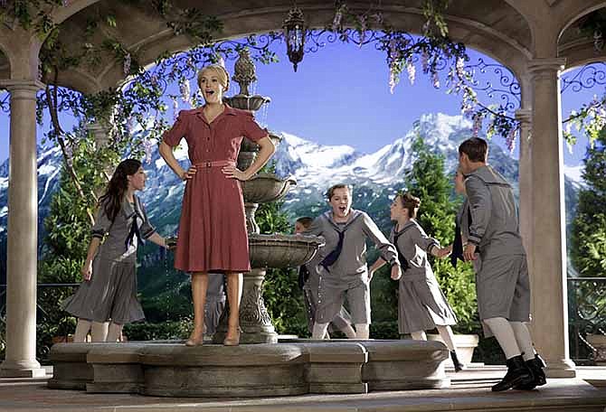 This image released by NBC shows Carrie Underwood, foreground, as Maria, during preparations for "The Sound of Music Live!, in Bethpage, N.Y. The live production airs on Dec. 5 at 8 p.m. EST.