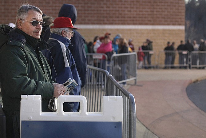 Bill Konen waits first in line for the Best Buy early Black Friday sale Thursday evening. Konen said he had forgone the traditional Thanksgiving dinner to arrive at 7 a.m. for the 6 p.m. door opening.