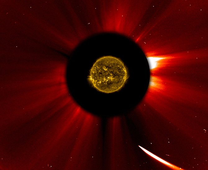 In a composite image provided by NASA, Comet ISON nears the sun in an image captured at 10:51 a.m. Eastern Standard Time on Thursday. The sun was imaged by NASA's Solar Dynamics Observatory, and an image from ESA/NASA's Solar and Heliospheric Observatory shows the solar atmosphere, the corona.