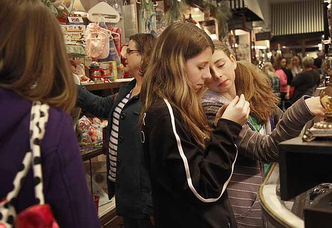 
Catherine Sauer, 15, left, and Miranda Sauer look at gift items at Southbank Gift Company during the afternoon of Small Business Saturday. Business was brisk on the day designated to encourage shoppers to support local stores that support the community.