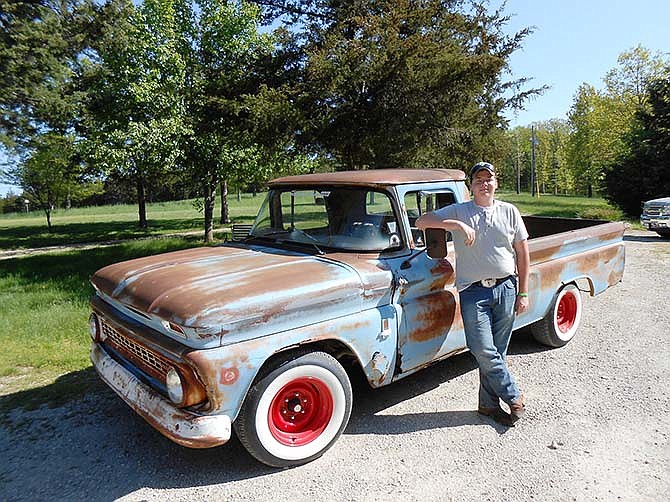 Clayton White, a member of the Mid-Mo Old Car Club, is the first to receive the club's $1,000 scholarship.