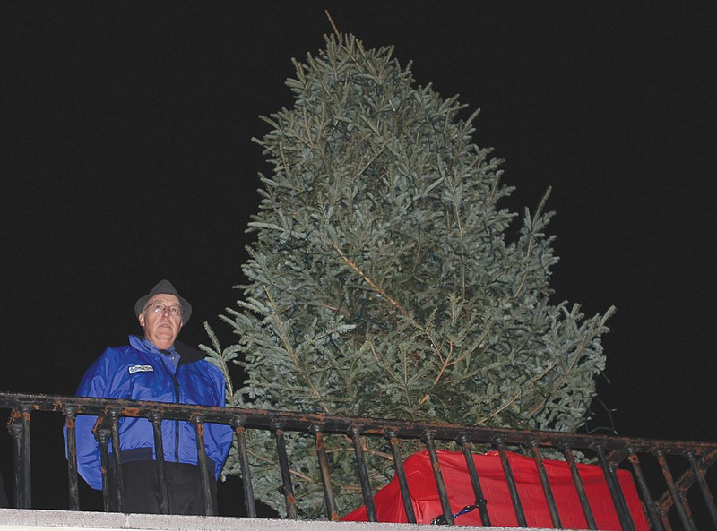 After an introduction from National Churchill Museum Executive Director Rob Havers, Fulton Mayor LeRoy Benton addresses the crowd that's formed outside of the museum before lighting the tree at the inaugural Community Tree Lighting Ceremony Monday. 