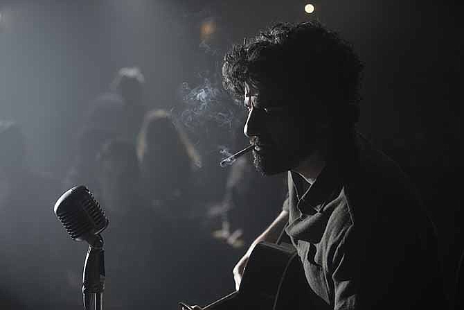 This film image released by CBS FIlms shows Oscar Isaac in a scene from "Inside Llewyn Davis." 