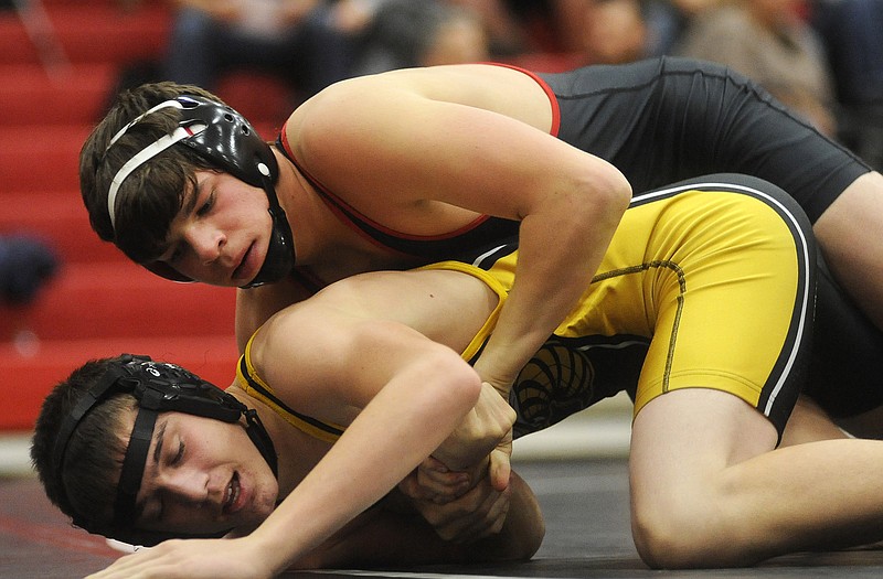 Jefferson City's Logan Moriarity grapples with Lebanon's Dakota Shockley in a 145-pound match Wednesday night at Fleming Fieldhouse.