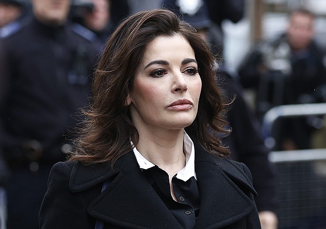 Celebrity chef, Nigella Lawson, arrives Wednesday at Isleworth Crown Court in London, where she faces questions Wednesday about alleged drug use when she appears as a witness at the fraud trial of her former personal assistants.