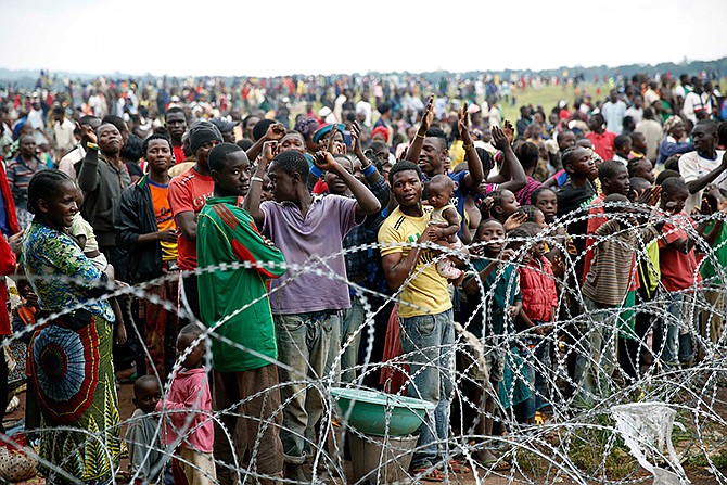 Internally displaced people gathered Friday at Bangui's airport in Central African Republic, cheered at the sight of landing French military helicopters, a day after a gun battle between Seleka soldiers and Christian militias left more than 100 dead and scores wounded. To try to put an end to sectarian violence, the UN security council passed a motion allowing French troops to deploy in the country in order to protect civilians and ensure security by all necessary means.