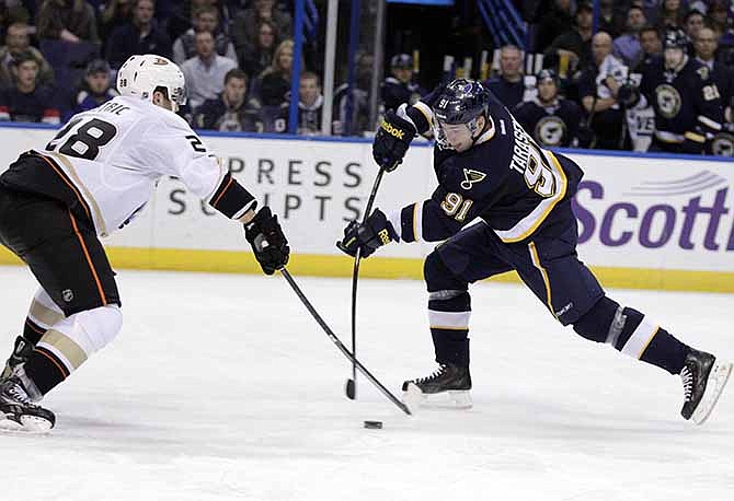 St. Louis Blues' Vladimir Tarasenko (91) fires a shot past Anaheim Ducks' Mark Fistric (28) in the second period of an NHL hockey game, Saturday, Dec. 7, 2013, in St. Louis. 