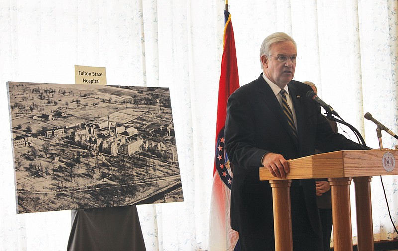 Gov. Jay Nixon addresses a crowded Fulton State Hospital canteen amid a backdrop of the mental health facility's historic campus Monday. Nixon announced that he was releasing the remaining $11 million in state funds needed for planning and designing a new Fulton State Hospital and his budget proposal for Fiscal Year 2015 would recommend issuing bonds to cover the remainder of the $211 million project.