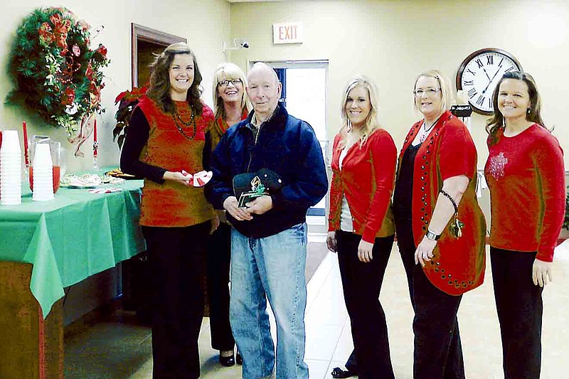 Commerce Bank staff with customer, Jack Bolin, during the Commerce Bank open house Friday. From left to right, Chelsea McGill, Bonnie George, Bolin, Zoe Huhmann, Marsha Pearson and Melanie McDonald.