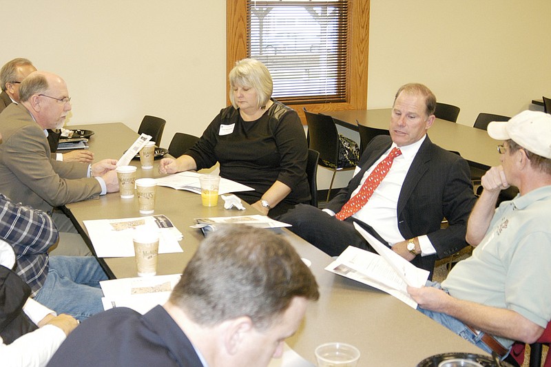 University of Missouri System President Tim Wolfe, center right, speaks with several local business and community leaders at California City Hall  Wednesday, Dec. 4. University of Missouri Curator Pam Henrickson also attended the meeting with businessman and school board president Steven Burger, Rep. David Wood, Mayor Norris Gerhart and Alderwoman Debbie Ferguson. They discussed concerns about education and workforce development needs.  