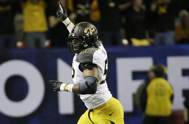 Missouri's Michael Sam was selected the Southeastern Conference Defensive Player of the Year in voting by the Associated Press.