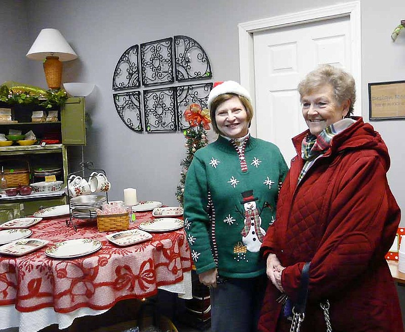 Democrat Photo/Paula Earls
Sharon Leeper of Inspired Gifts welcomes Dorothy Fulks to the shop during the open house, Saturday, Dec. 7.