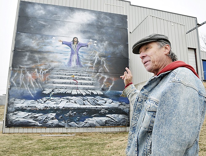 Dennis Holliday talks about the large mural he plans to auction to raise money for the Wounded Warrior Project. Holliday, known locally as "the starving artist," said he felt compelled to do the project and hopes to raise several thousand dollars for the charity.