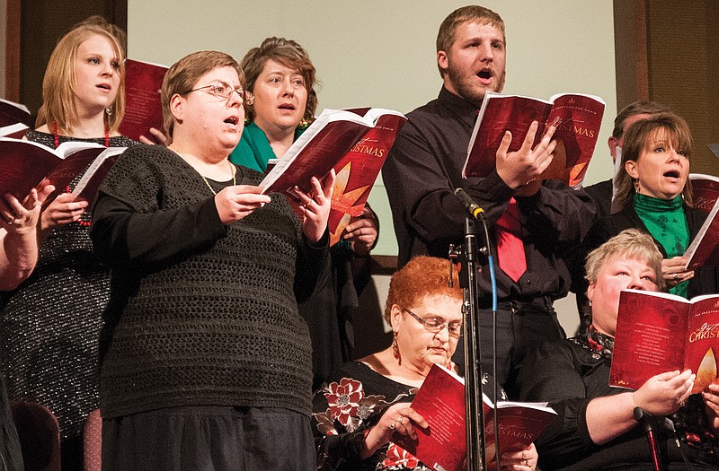 The Mid Missouri Christian Church sings Christmas carols on Tuesday at the First Baptist Church in Fulton. 