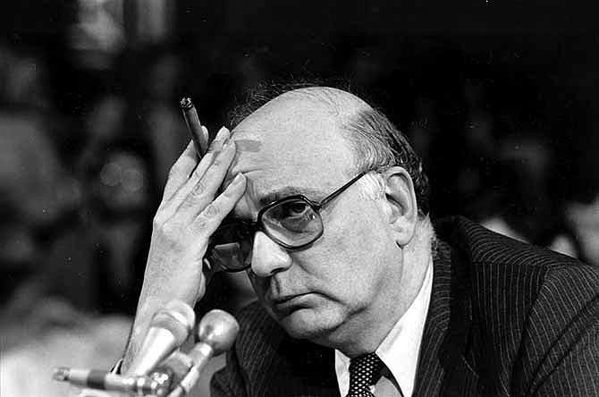In this March 18, 1980, file photo, Federal Reserve Board Chairman Paul Volcker listens to a question as he appears before a Senate committee in Washington, D.C. The Federal Reserve and the Federal Deposit Insurance Corp. each unanimously voted Tuesday to adopt the so-called Volcker Rule, taking a major step toward preventing extreme risk-taking on Wall Street that helped trigger the 2008 financial crisis. The rule which states that U.S. banks will be barred in most cases from trading for their own profit under a federal rule is named after Volcker, a former Fed chairman who was an adviser to President Barack Obama during the financial crisis.