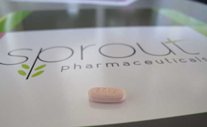 In this Friday, Sept. 27, 2013, photo, a tablet of flibanserin sits on a brochure for Sprout Pharmaceuticals in the company's Raleigh, N.C., headquarters on Friday, Sept. 27, 2013. Sprout Pharmaceuticals said Wednesday, Dec. 11, 2013, it has reached an impasse with the Food and Drug Administration over its drug, flibanserin. The daily pill is designed to increase libido in women by acting on brain chemicals linked to mood and appetite.