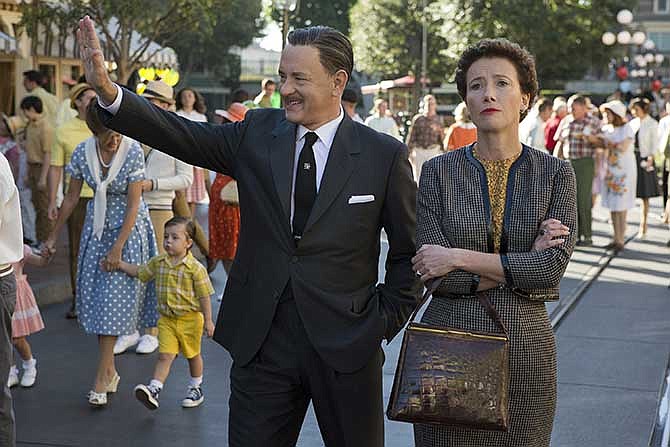 This image released by Disney shows Tom Hanks as Walt Disney, left, and Emma Thompson as author P.L. Travers in a scene from "Saving Mr. Banks."