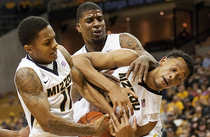 Missouri's Shane Rector (left), Tony Criswell (center) and Johnathan Williams III fight each other for a rebound against West Virginia last week at Mizzou Arena.